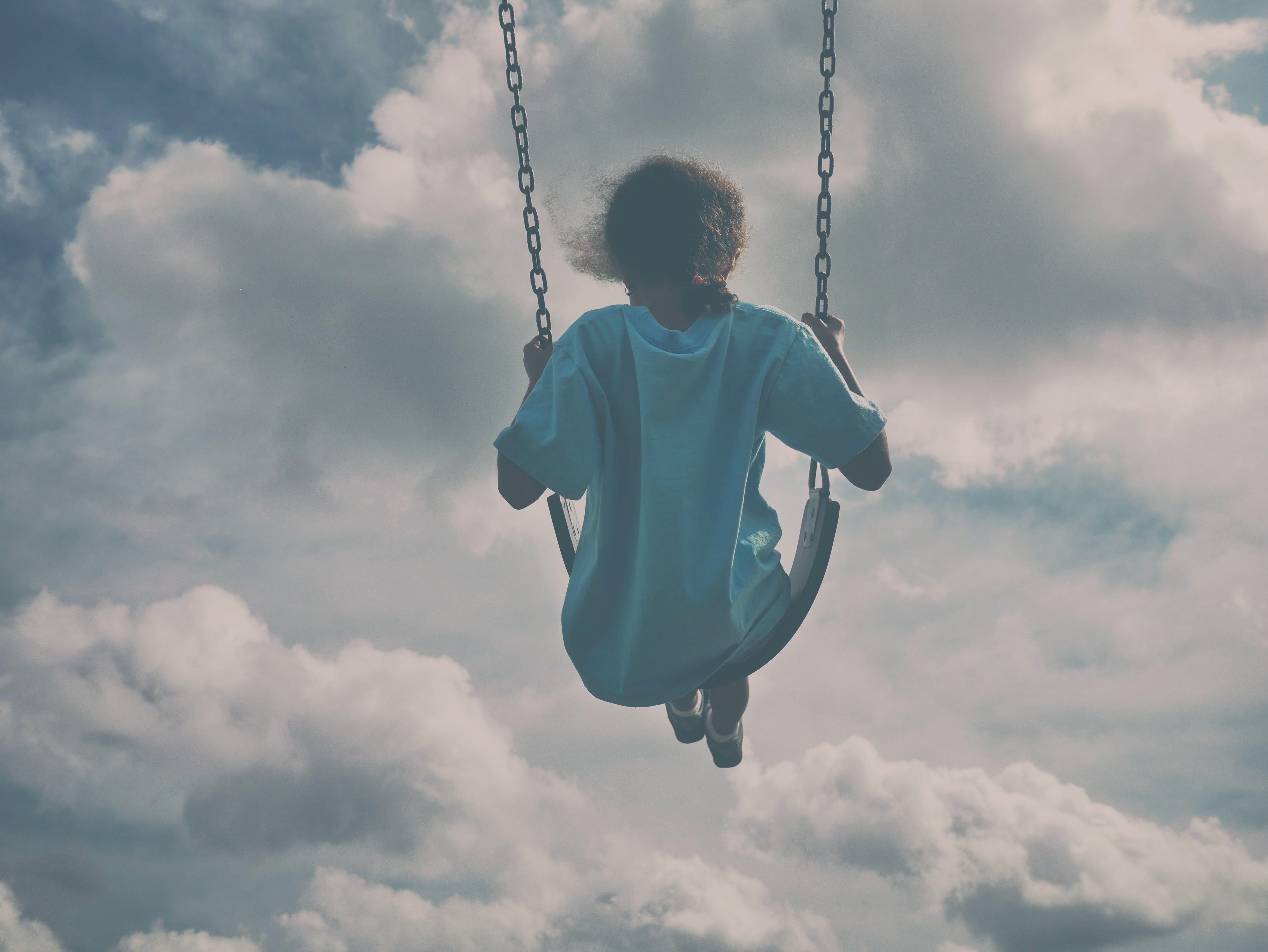 Girl In White Shirt Sitting On Swing Under Gray Clouds - Swing In The Sky , HD Wallpaper & Backgrounds