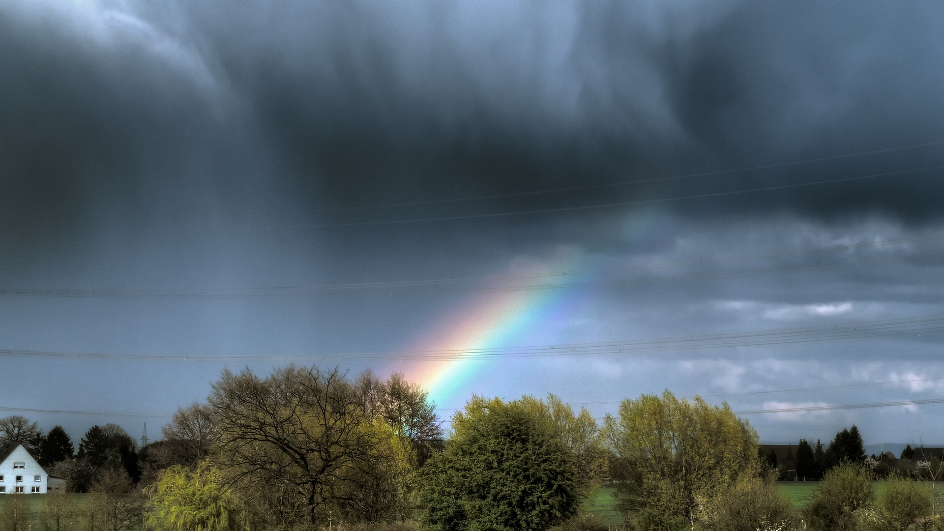 Rainbow Through Rain Clouds Wallpaper - Rain Clouds With A Rainbow , HD Wallpaper & Backgrounds