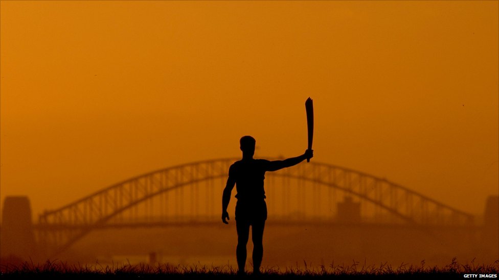 The 2000 Sydney Olympic Games Torch Silhouetted Against - Olympic Torch , HD Wallpaper & Backgrounds