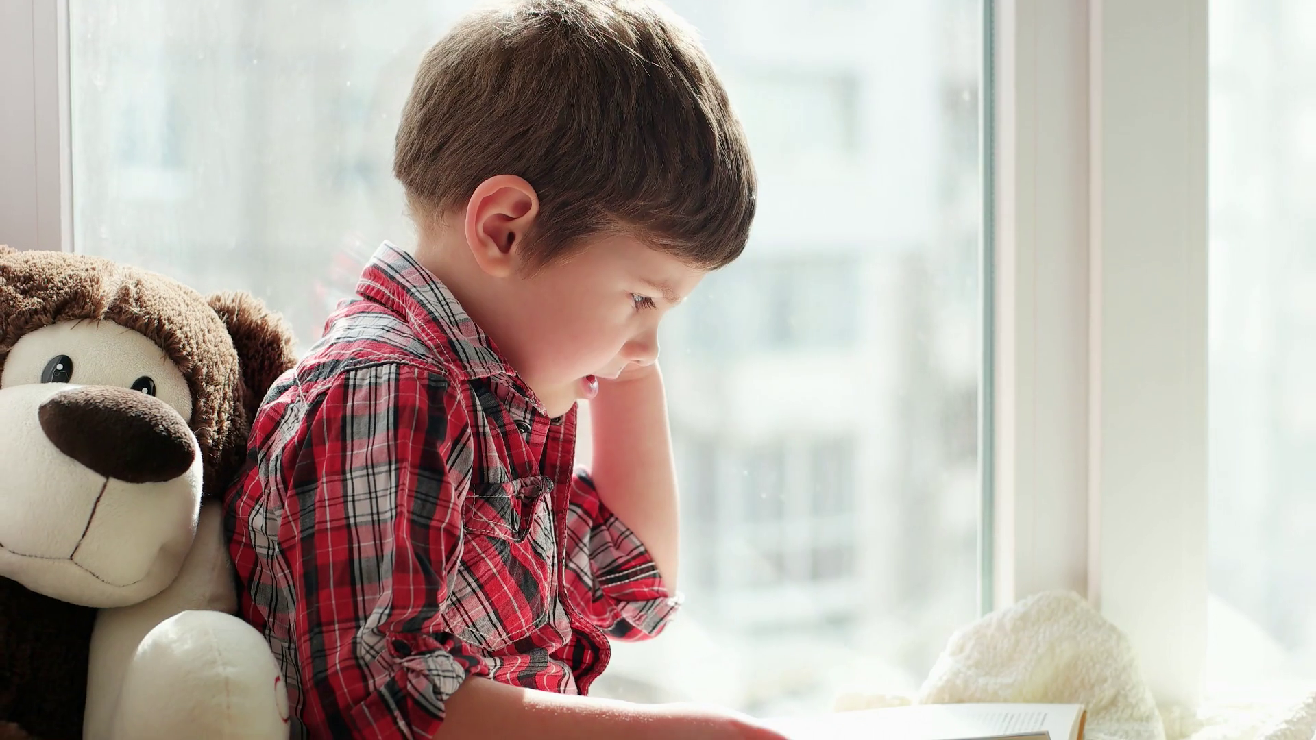 Little Boy Reading Book Of Tales With His Toy Smart Kids