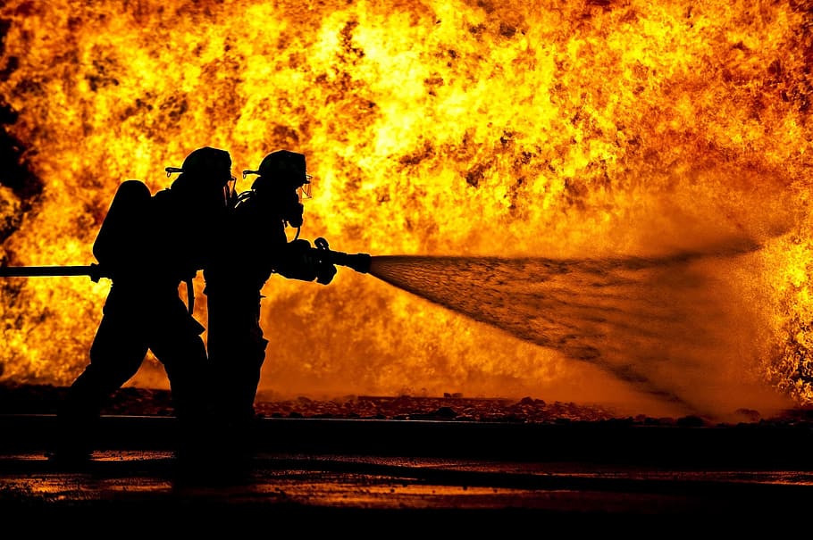Two Fireman Blowing Water Using Hose On Fire, Firefighters, - Firefighter In Front Of Fire , HD Wallpaper & Backgrounds