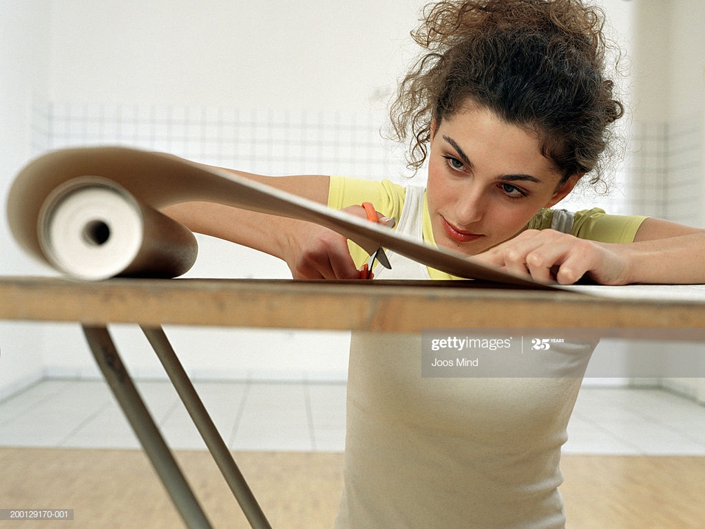 Young Woman Cutting Wallpaper On Pasting Table - Plywood , HD Wallpaper & Backgrounds