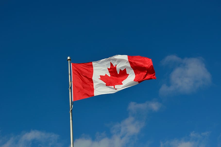 Canada Flag Under The Blue Sky During Daytime, Canadian - Canada Flag Wallpaper 4k , HD Wallpaper & Backgrounds