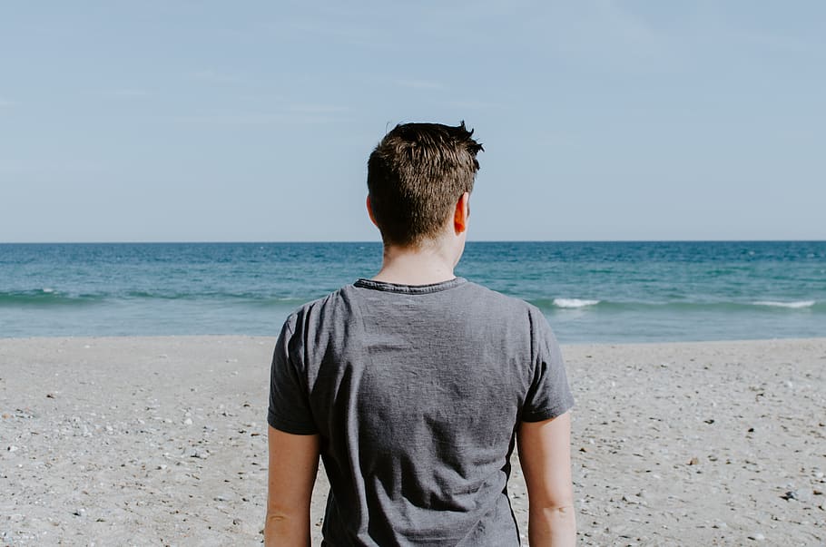 Man Standing On Beach Shore During Daytime Water Man Back Wallpaper