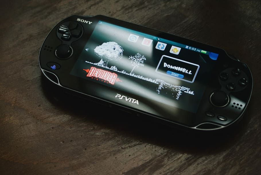 Black Sony Ps Vita On Brown Wooden Surface, Turned - Gaming Console , HD Wallpaper & Backgrounds